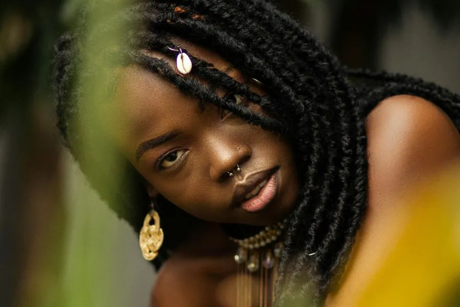 young woman with a nose piercing wearing traditional jewelry